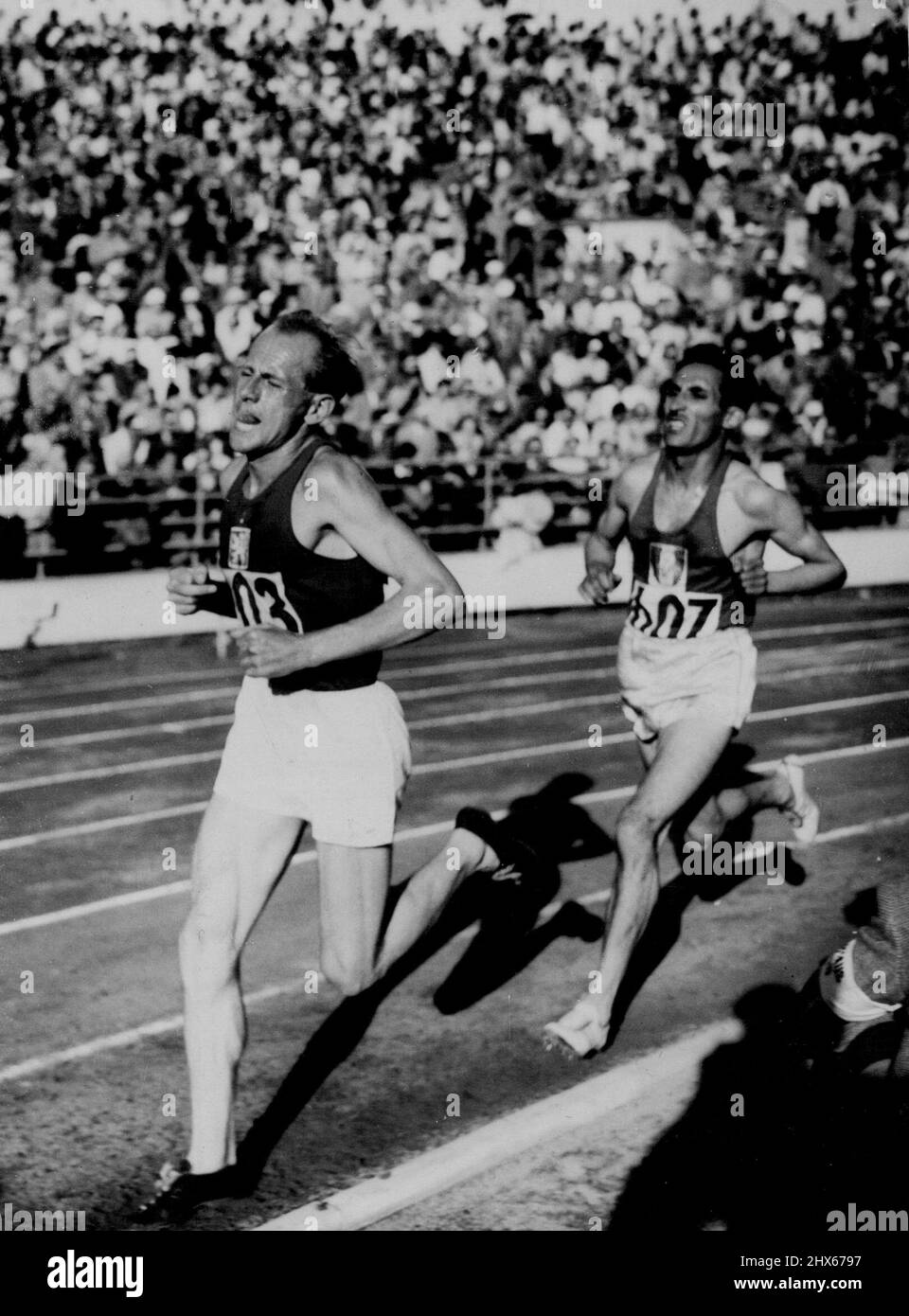 Zatopek Wins 10,000 Metres And Gains First 1952 Olympics Gold Medal -- Emil Zatopek, the flying Czech Army major, leading A. Mimoun, of France, who was second, in the last lap of the gruelling 10,000 metres in the Olympic Games here. Shaking off the challenge by the Frenchman, Zatopek covered the distance in 29 minutes and 17 seconds. His time knocks 42.6 seconds off the record he set up at Wembley in 1948 and was only 14.4 seconds slower than his own world record made in his own country two yea Stock Photo