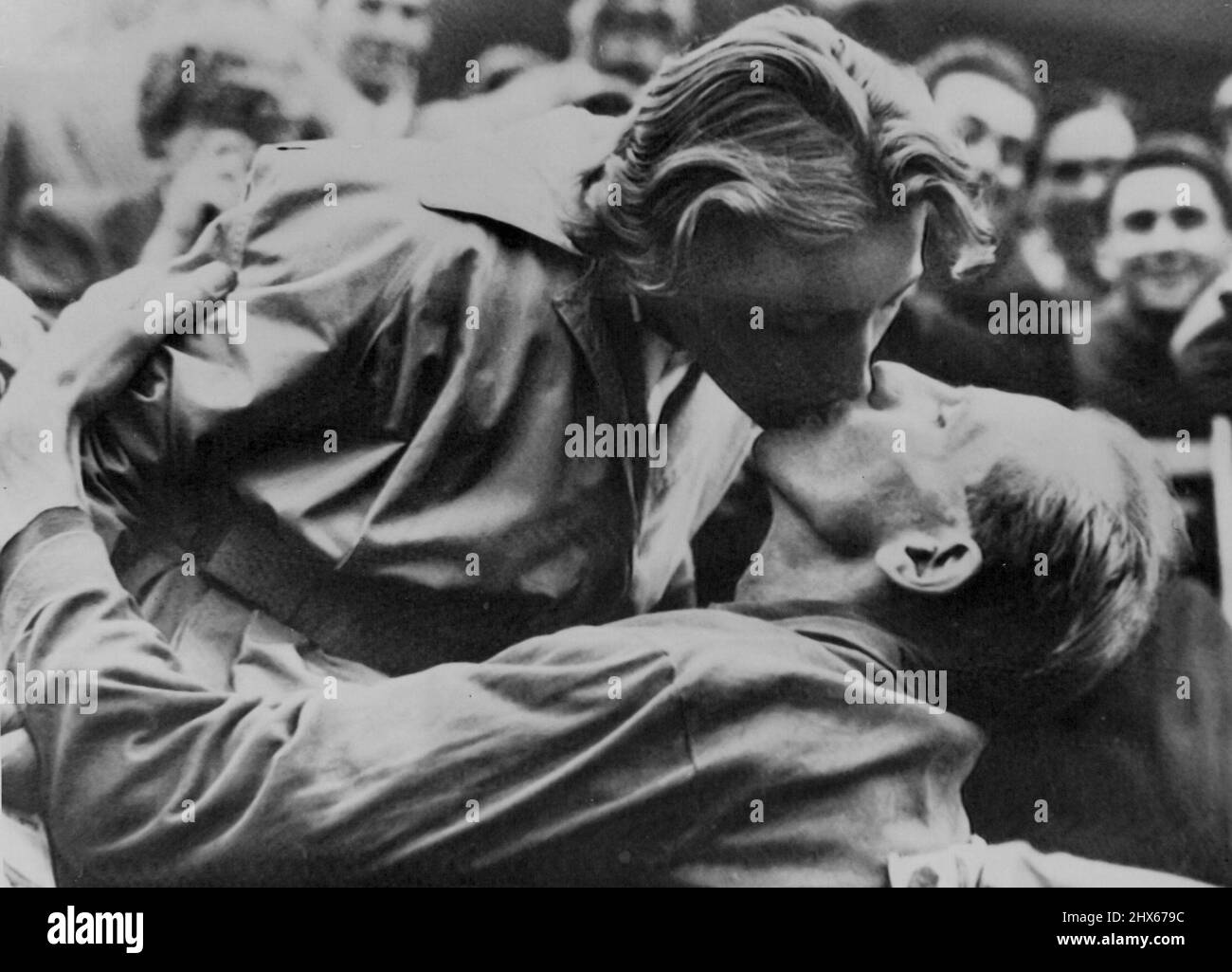 Wife Kisses Zatopek After Marathon Win -- Congratulatory kiss from his wife for Czech Army Major Emil Zatopek after he had won the marathon Olympic Games event to-day. The win marks the first time in history of the Games that an athlete has won all three of the long distance races; marathon, 10,000 and 5,000 metres. Reinaldo Corno of Argentina was second and Gustaf Jansson of Sweden third. Zatopek's wife, Dana Zatopkova, is herself an Olympic-gold medal winner, being victor of the women's javeli Stock Photo