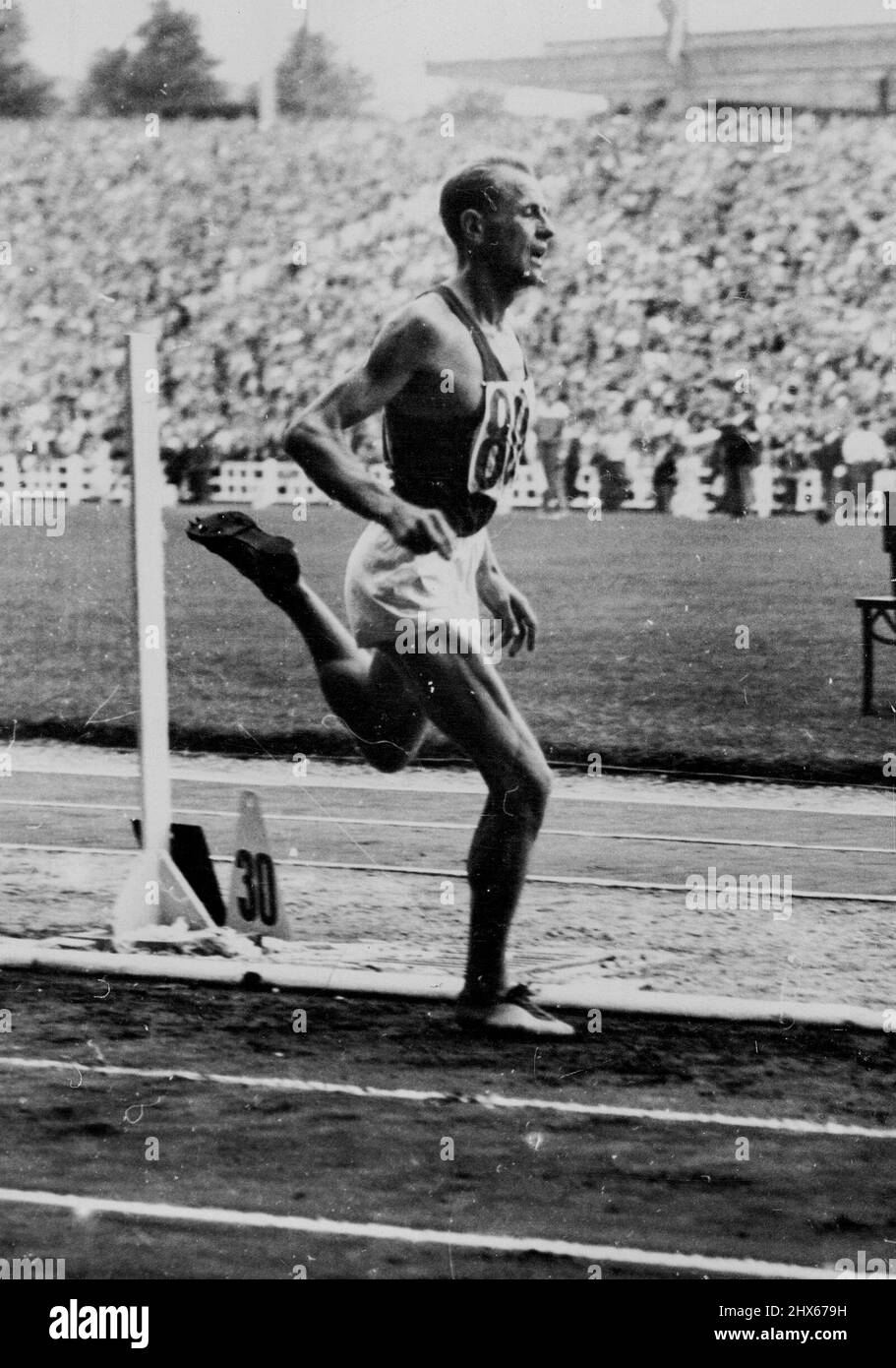 Zatopek Wins 5,000 Metres - And Sets Up New Games Record -- E. Zatopek, of Czechoslovakia, winning the 5,000 metres event at the European Games here. With a new Games championship time of 14 minutes, 3seconds, he was about a hundred yards ahead of A. Mimoun (France), who came second. Third was the Belgian Gaston Reiff, who defeated the Czech at Wembley in the 1948 Olympic Games. August 27, 1950. Stock Photo
