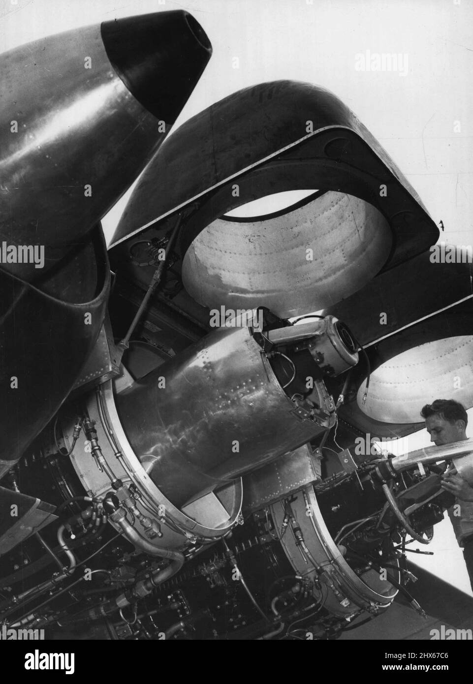 The Lid Is Off Jet Power: First released photograph of the powerful General Electric TG-180 (Allison J-35) jet engines on the Martin XB-48 high-speed, six-jet airplane. Three jet engine are mounted in each wing of the Air Force bomber, now undergoing flight tests at Wright- Patterson Air Force Base, Dayton, Ohio, Cowling on two of the engines have been raised to permit inspection and give some idea of how 11,000 pounds of thrust is produced by each engine. The XB-48 weighs 102,600 pounds and ca Stock Photo