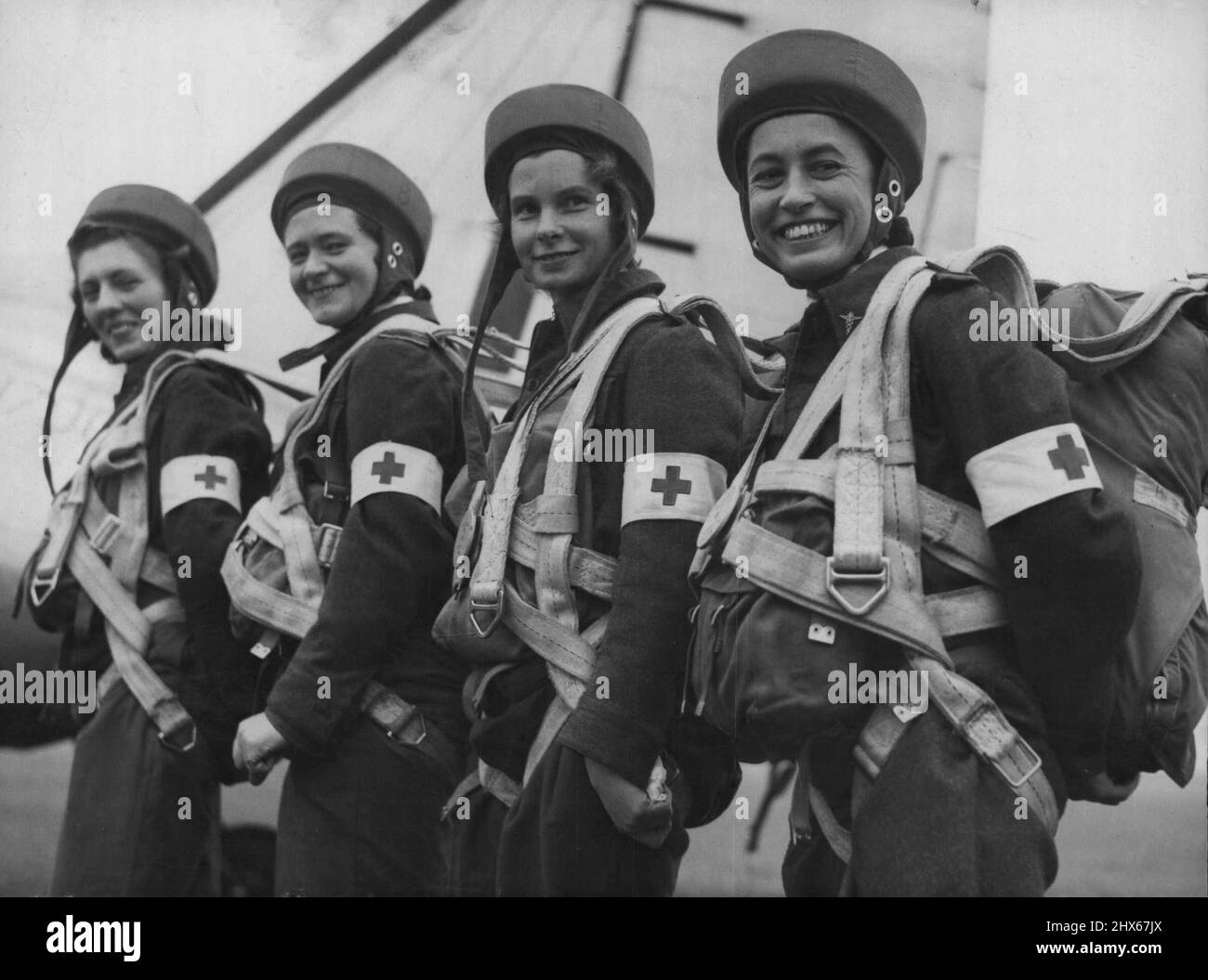 Three nursing sisters, in full equipment, of the RAF Medical Parachute team, are pictured before mak ng a practice jump at Upper Heyford, Eng. Left to right: Sister M.M. Bradley, of Tyrone; Senior S.J.H. Maffey, of London; and Sister M.L. Savage, of York. October 22, 1948. Stock Photo