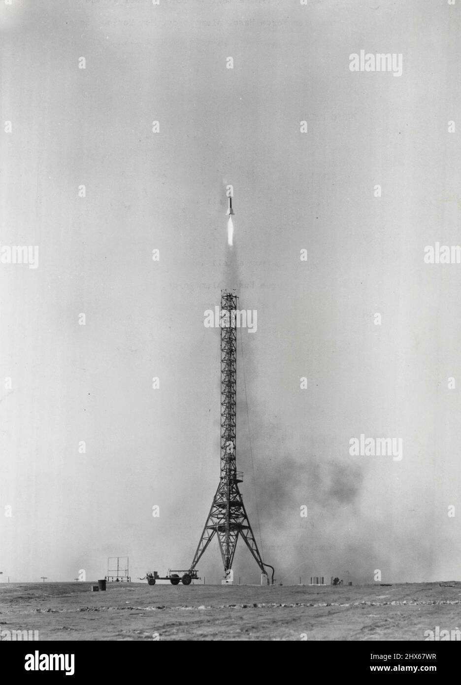 Flaming from a tall launching tower at the Holloman Air Force Base