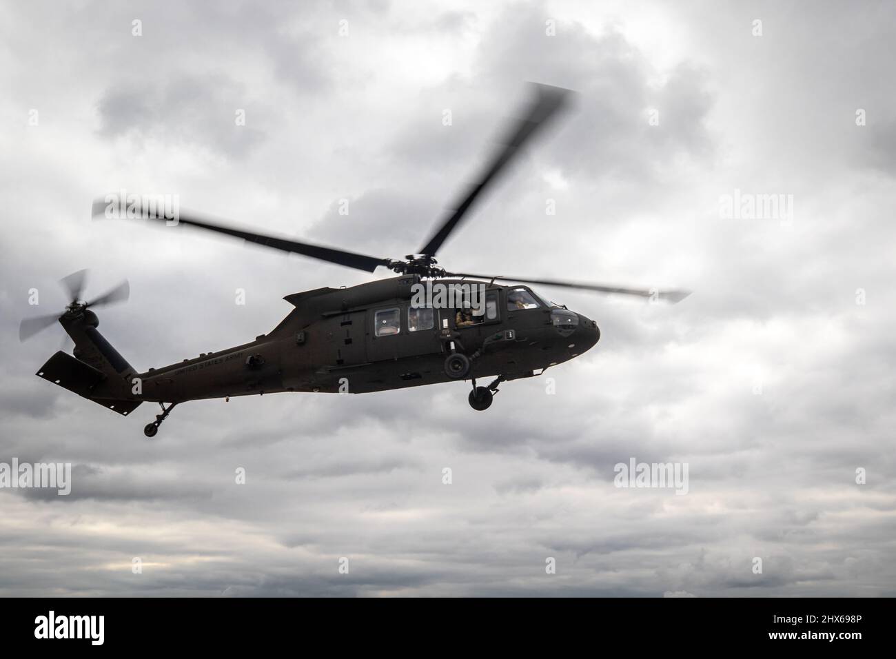 POWIDZ, Poland – 1st Air Cavalry Brigade UH60M Blackhawk helicopter lands in Powidz, Poland, Feb. 26, 2022.     1st Air Cavalry Brigade, which is in Europe for Atlantic Resolve, moved 20 AH64 Apaches and over 400 personnel to Poland from Greece and Germany in less than 5 days to support the United States’ decision to increase its presence and activities in Poland as part of its strong and unremitting commitment to our NATO allies and partners. (U.S. Army Photo by Capt. Taylor Criswell) Stock Photo