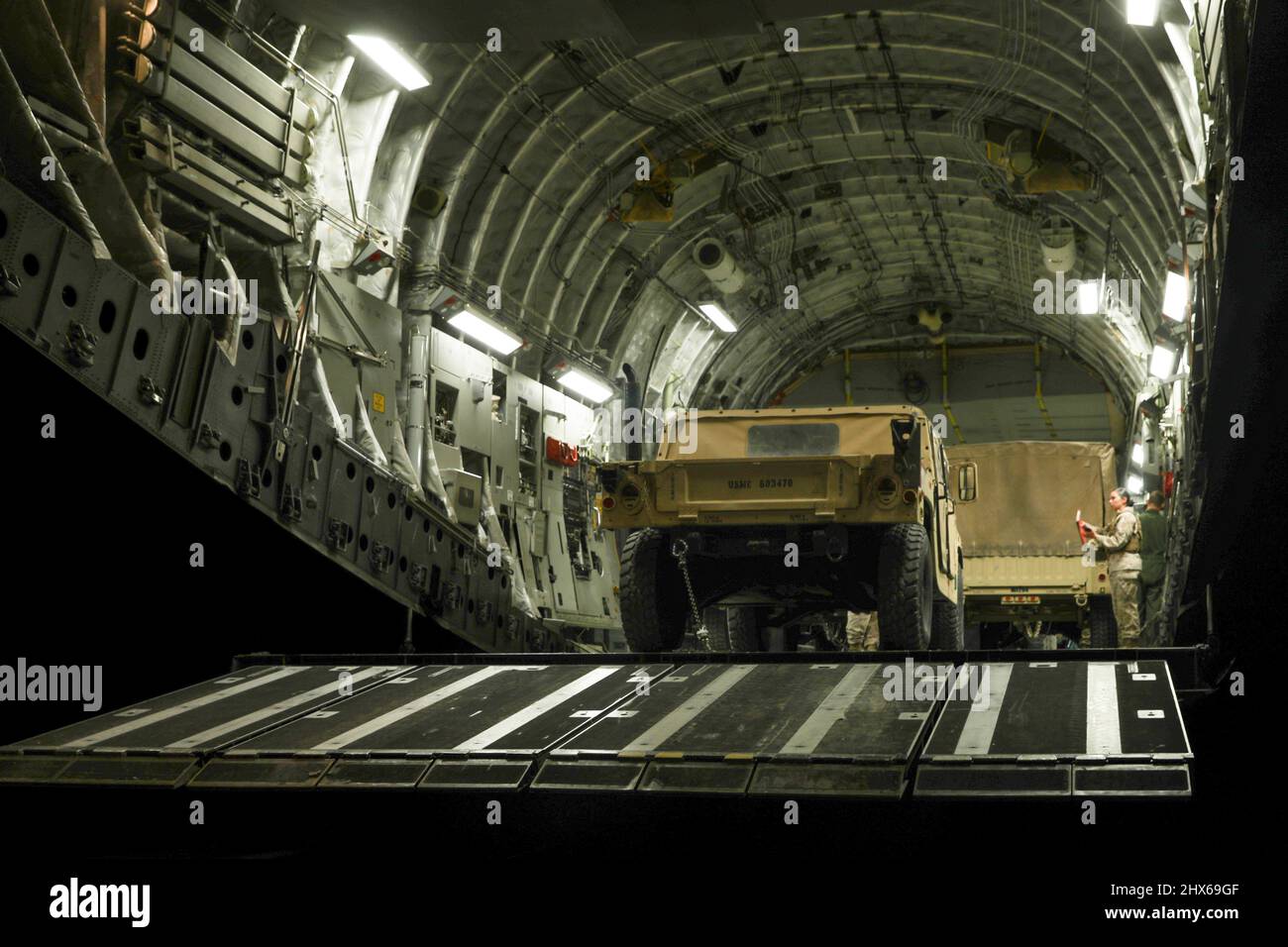 U.S. Marine Corps Humvees assigned to 7th Marine Regiment, 1st Marine Division, are staged in preparation for a flight on a C17 Globemaster III assigned to 21st Airlift Squadron, Travis Air Force Base, California, during a command post exercise at Fort Hunter Liggett, California, March 1, 2022. This evolution provided an opportunity for Marines to practice expedient setup of a regimental headquarters, enabling command and control from distributed locations. (U.S. Marine Corps photo by Sgt. Jailine L. AliceaSantiago) Stock Photo