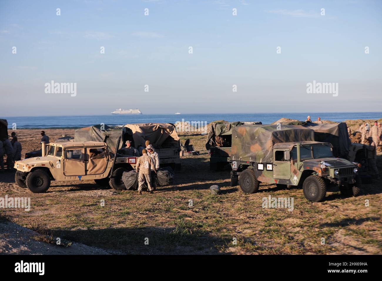 U.S. Marines with 7th Marine Regiment, 1st Marine Division, stage tactical vehicles during a command post exercise on Naval Amphibious Base Coronado, California, March 2, 2022. This evolution provided an opportunity for Marines to practice expedient setup of a regimental headquarters, enabling command and control from distributed locations. (U.S. Marine Corps photo by Sgt. Jailine L. AliceaSantiago) Stock Photo