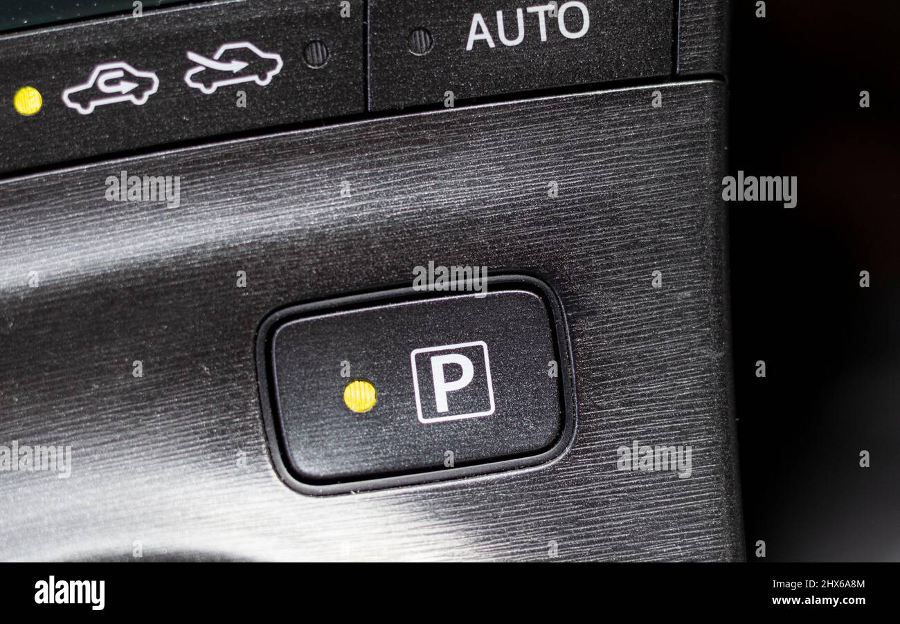 Electronic car parking park button with led light Stock Photo