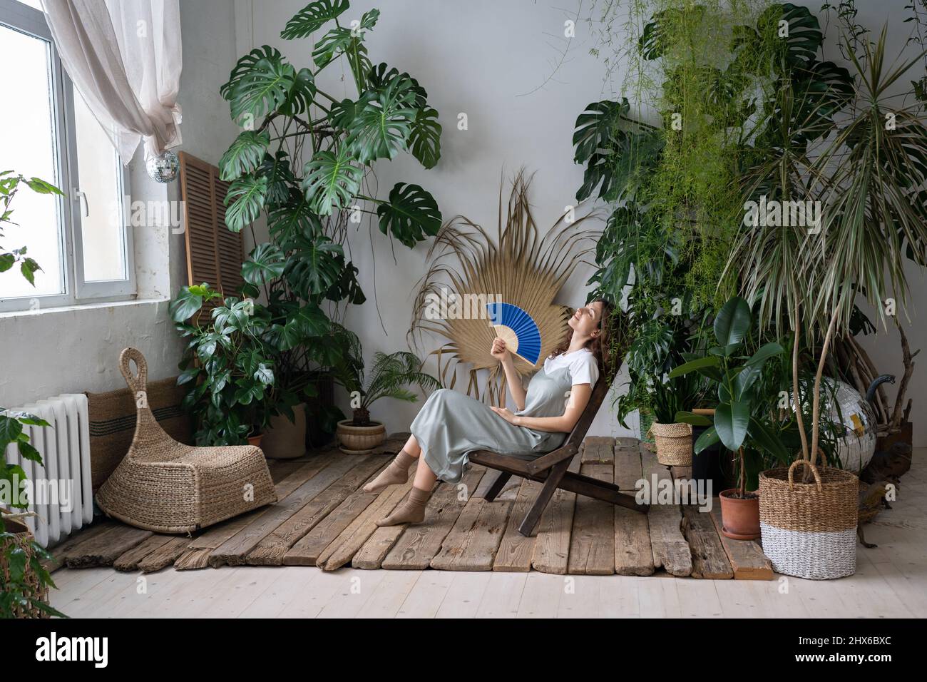 Stress relief after work. Relaxed young girl spend time in cozy indoor