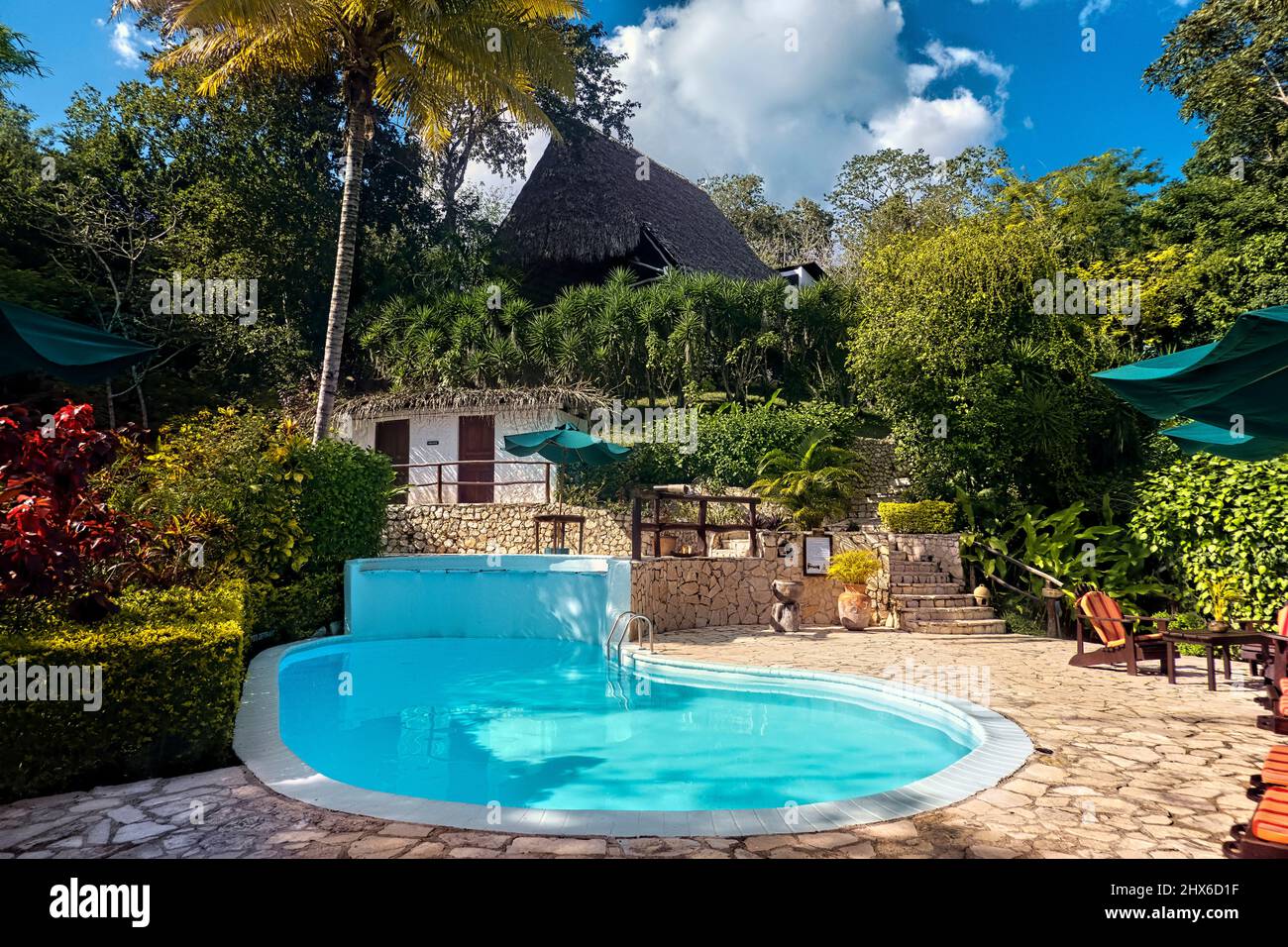 Luxury resort pool, Lake Peten Itza, El Remate, Petén, Guatemala Stock Photo