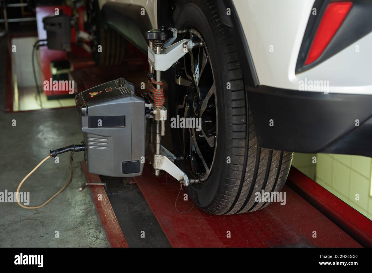 car wheel alignment in progress at auto repair service station Stock Photo Alamy