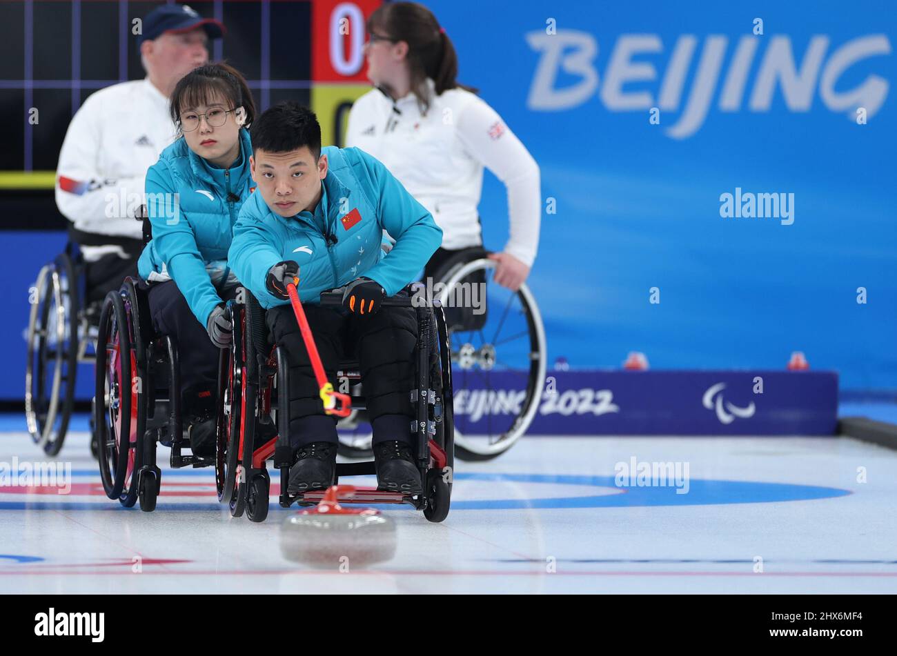 Beijing, China. 10th Mar, 2022. Zhang Mingliang (front) of China ...