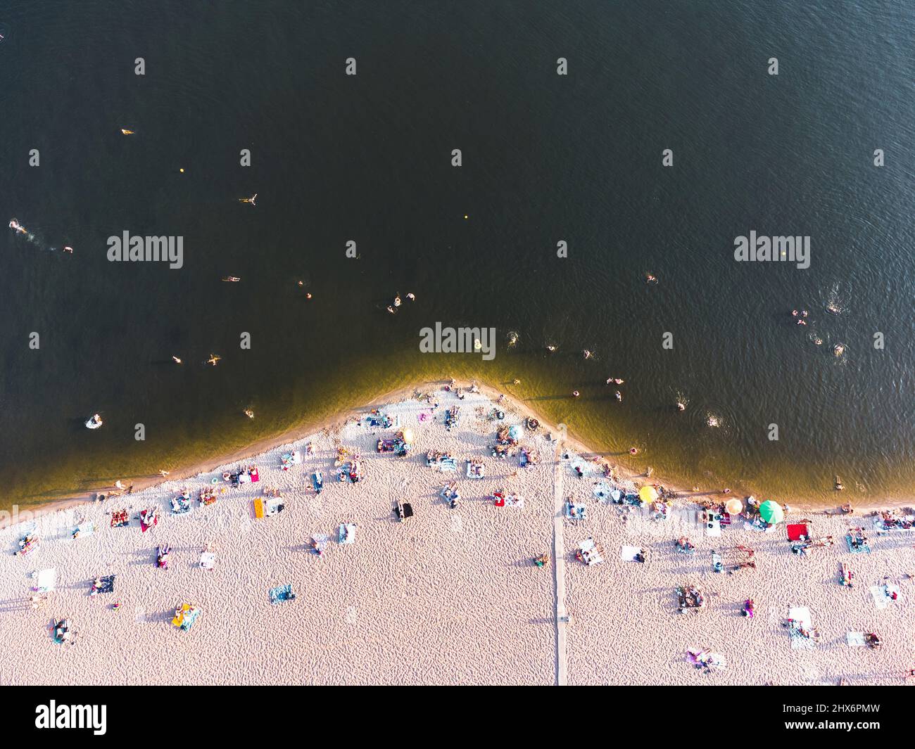 Aerial view on coastline. Summer seascape in sunny day. Top view of people on the beach from drone. Summer seascape Stock Photo