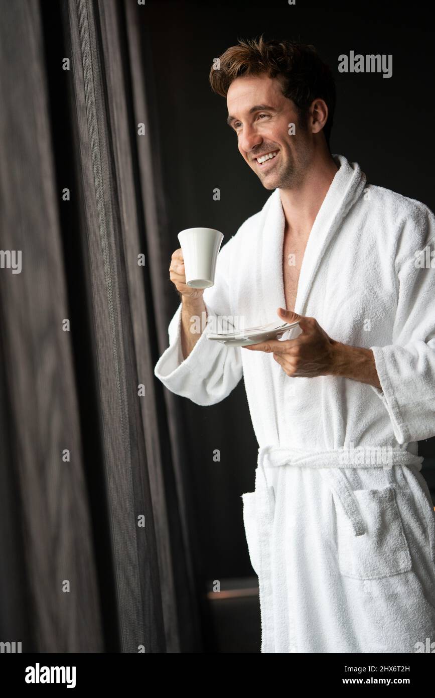 Handsome man in bathrobe relaxing at spa wellness hotel Stock Photo Alamy