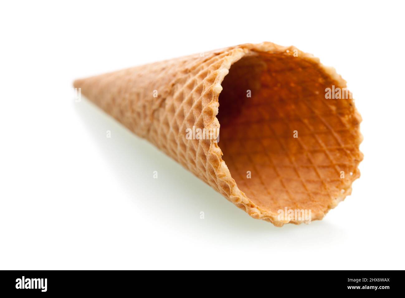 An empty ice cream cone isolated on white background Stock Photo - Alamy