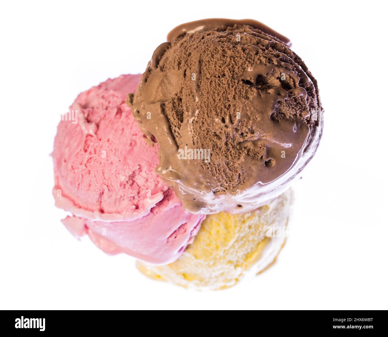 Looking down on an ice cream cone with edible chocolate, strawberry and vanilla ice cream