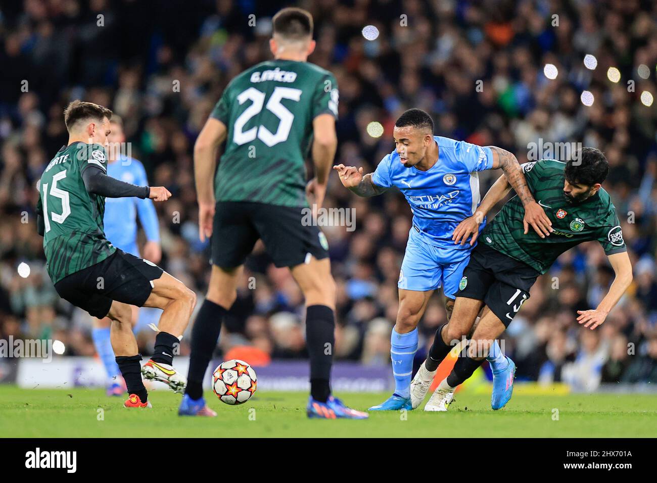 Gabriel Jesus #9 of Manchester City  and Luis Neto #13 of Sporting Lisbon challenge for the ball Stock Photo