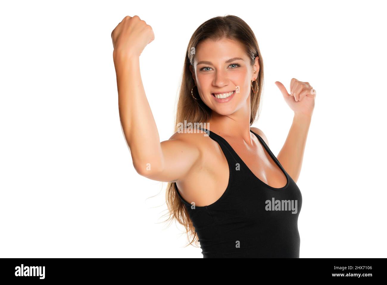 Young woman shows biceps hi-res stock photography and images - Alamy