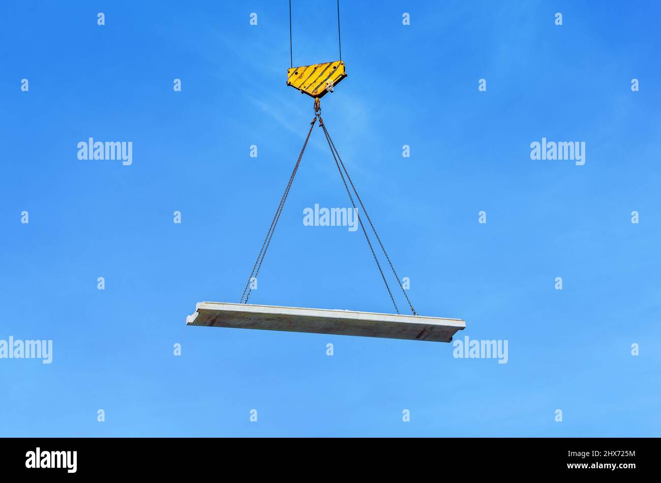 Concrete slab hanging on the cables of the crane hook Stock Photo Alamy