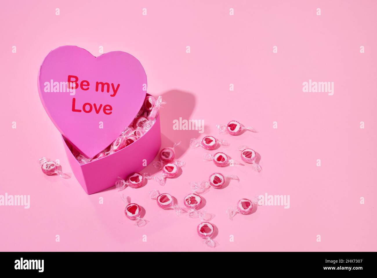 Candies in heart-shaped box Stock Photo