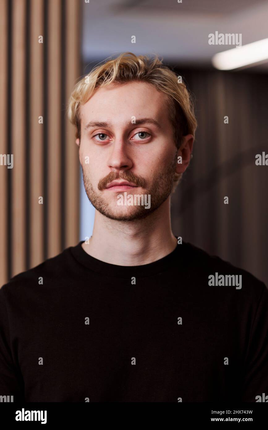 Serious young man working hi-res stock photography and images - Alamy