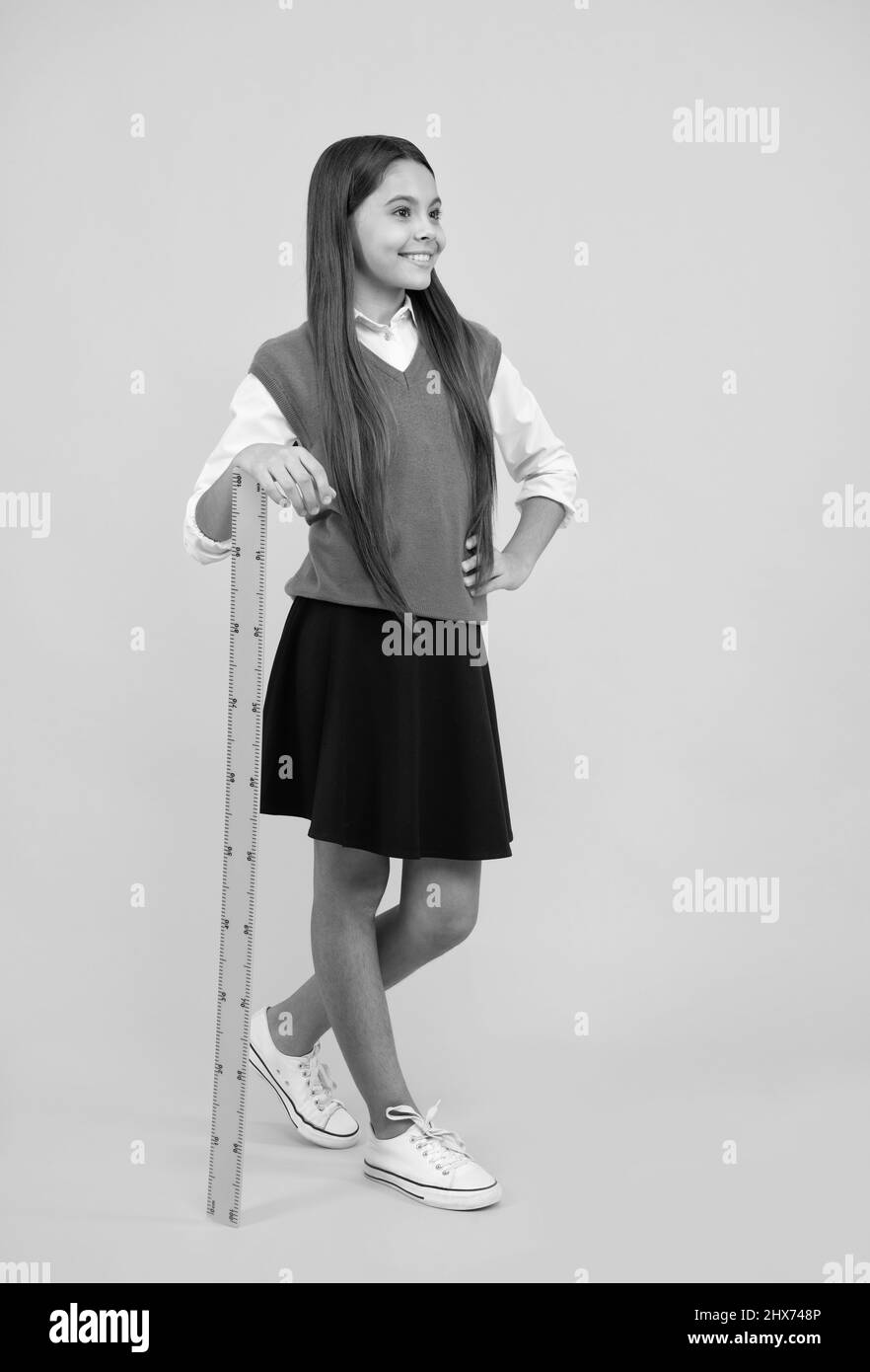 happy kid girl use ruler to learn mathematics, measurement Stock Photo