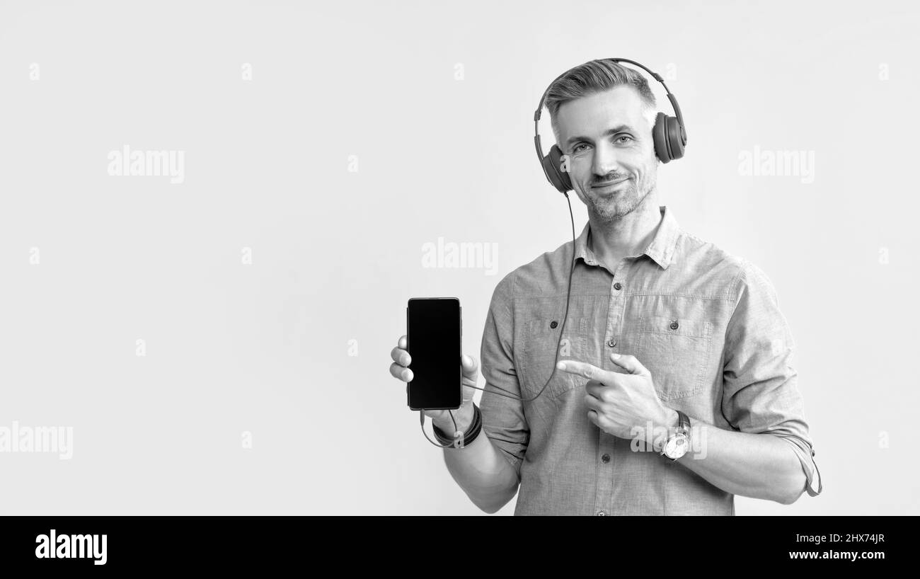 guy in earphones. musical playlist. mobile music application. new app. Stock Photo