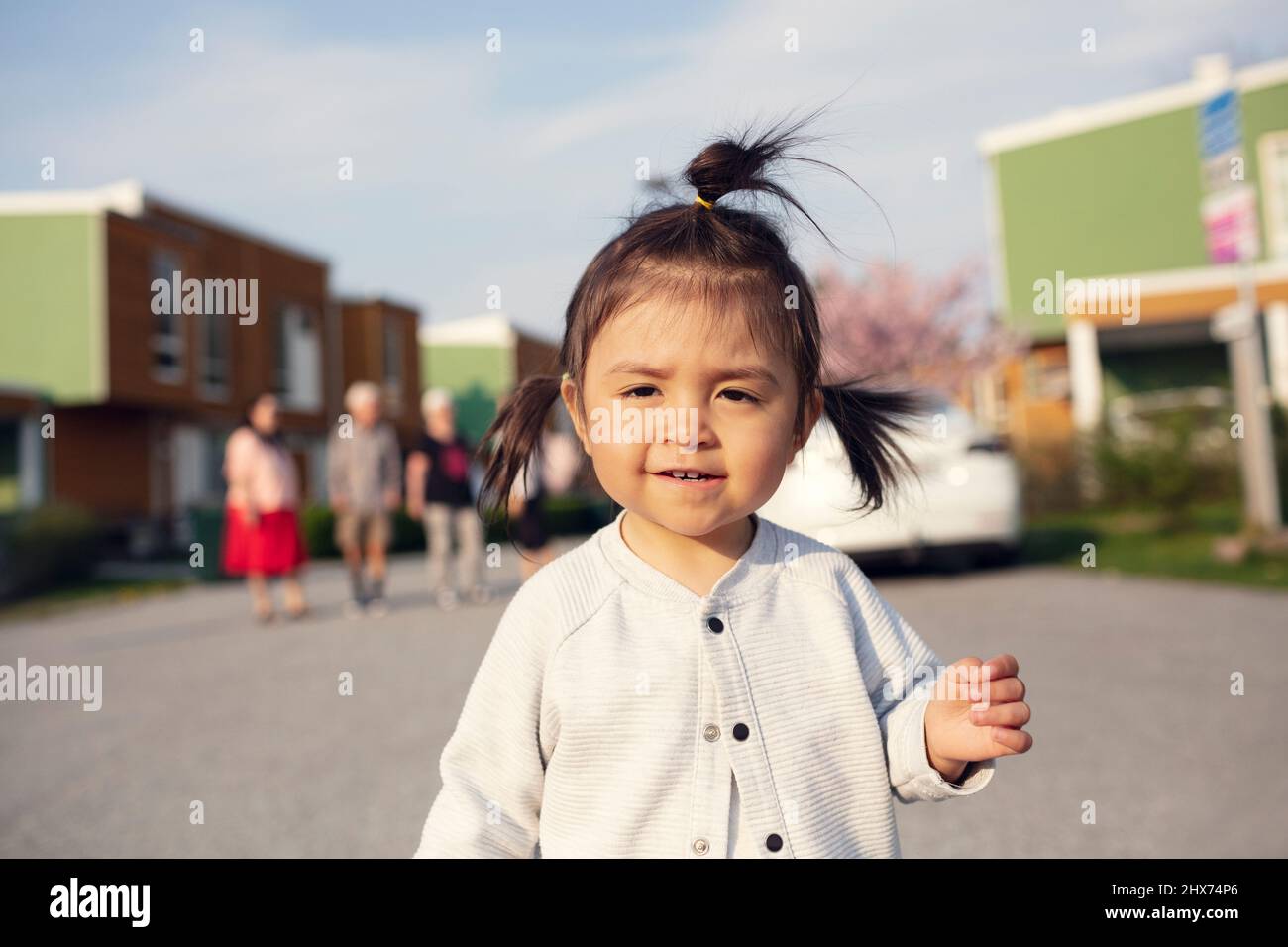 Smiling girl looking at camera Stock Photo - Alamy