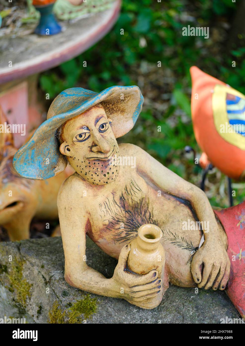 Sculptures made by a local pottery The Paloc village Hollokoe in Hungary, listed as UNESCO world heritage. The traditional farm houses form a complete Stock Photo