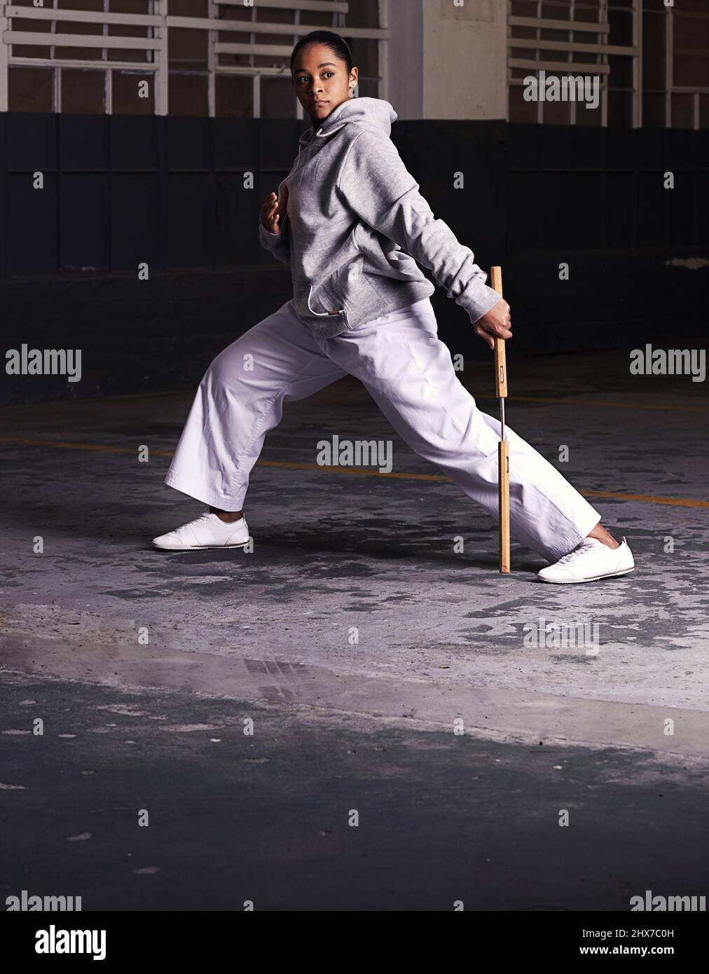The heart of a fighter. Shot of a young woman practicing martial arts. Stock Photo
