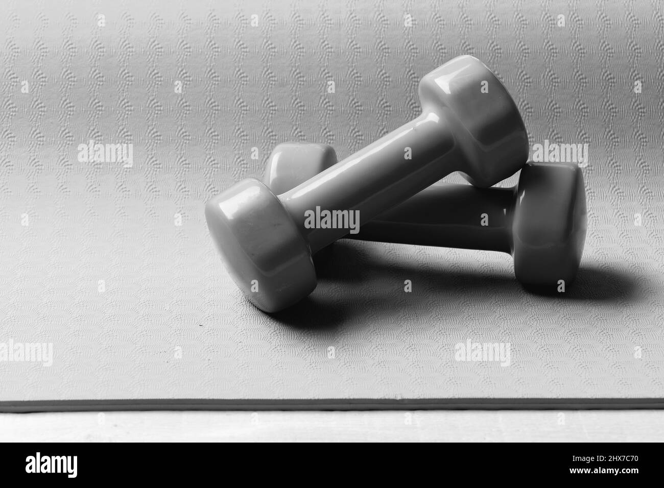Shaping and fitness equipment. Dumbbells made of green plastic Stock Photo Alamy