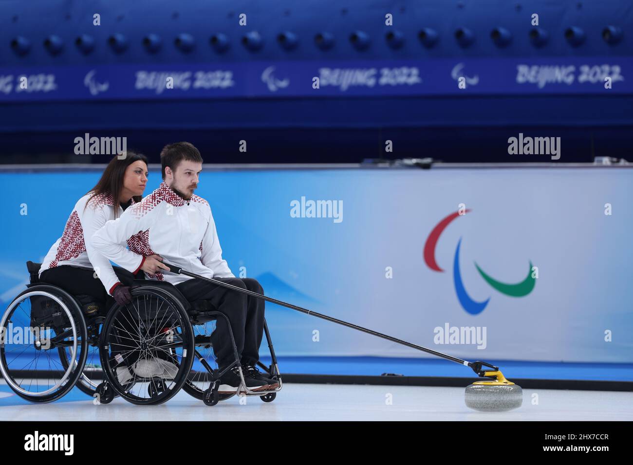Beijing, China. 10th Mar, 2022. Sergejs Djacenko (R) and Polina Rozkova