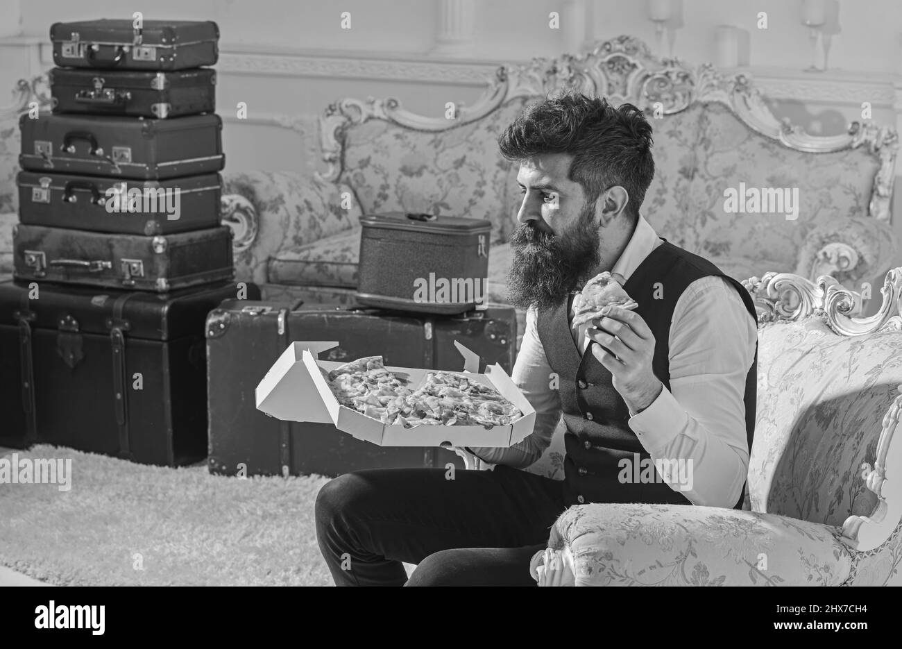 Bon appetit concept. Man with beard and mustache holds box with tasty