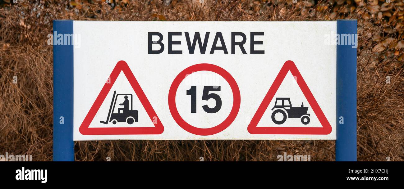 BEWARE sign - warning of forklift trucks and tractors, United Kingdom Stock Photo