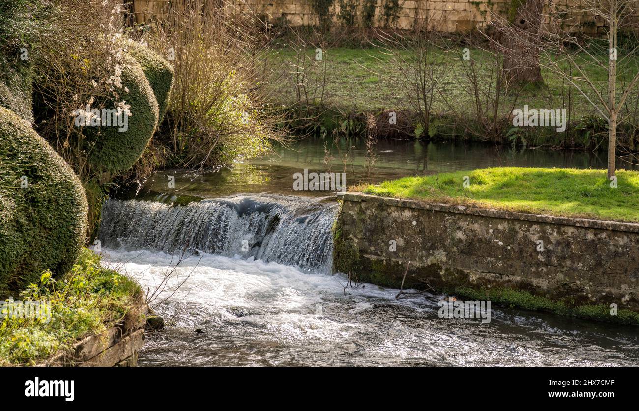 Weir on the River Frome in the old Brimscombe Port area of Stroud, The Cotswolds, Gloucestershire, United Kingdom Stock Photo