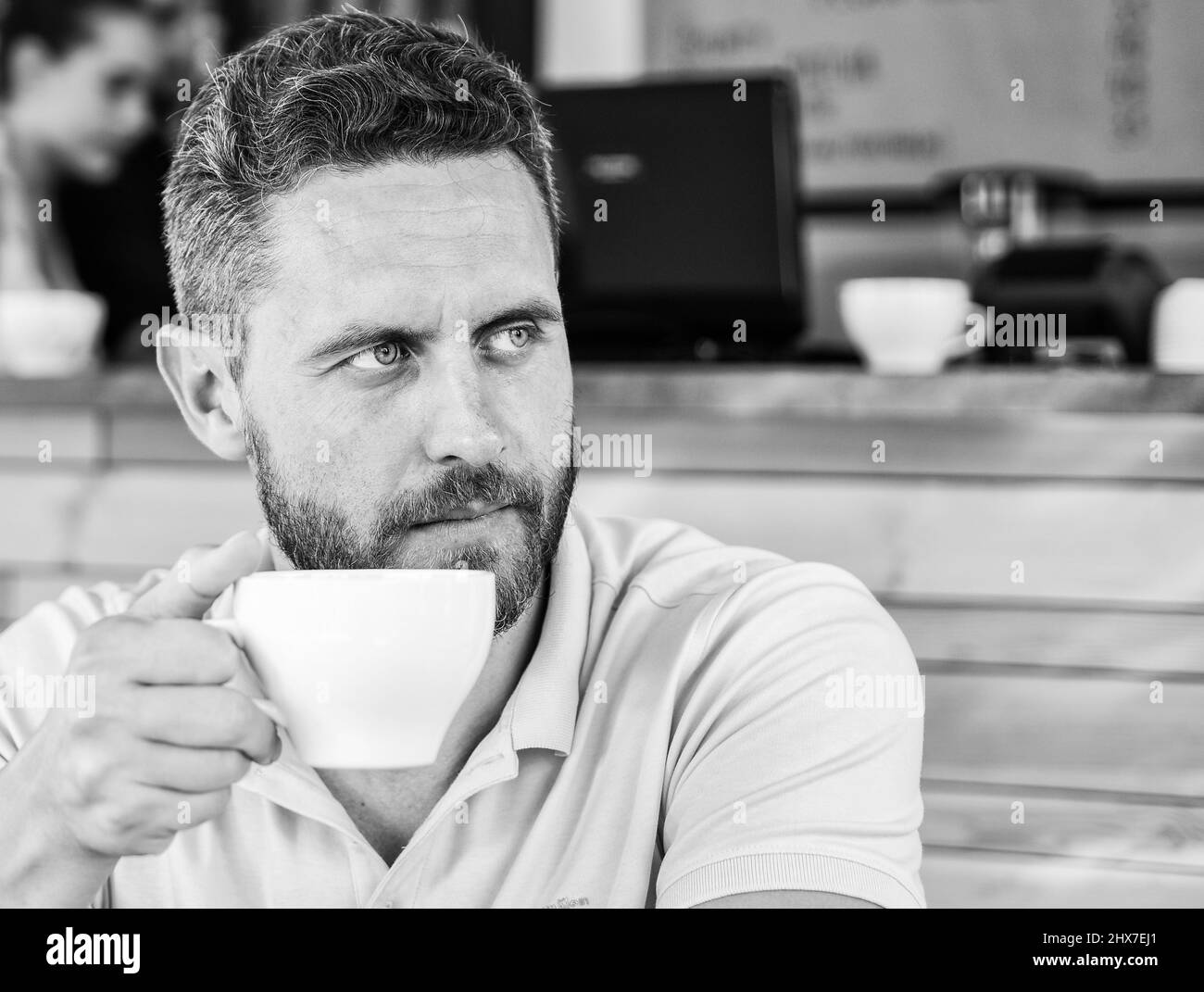 Start day with big cup of coffee. Man bearded serious face needs energy