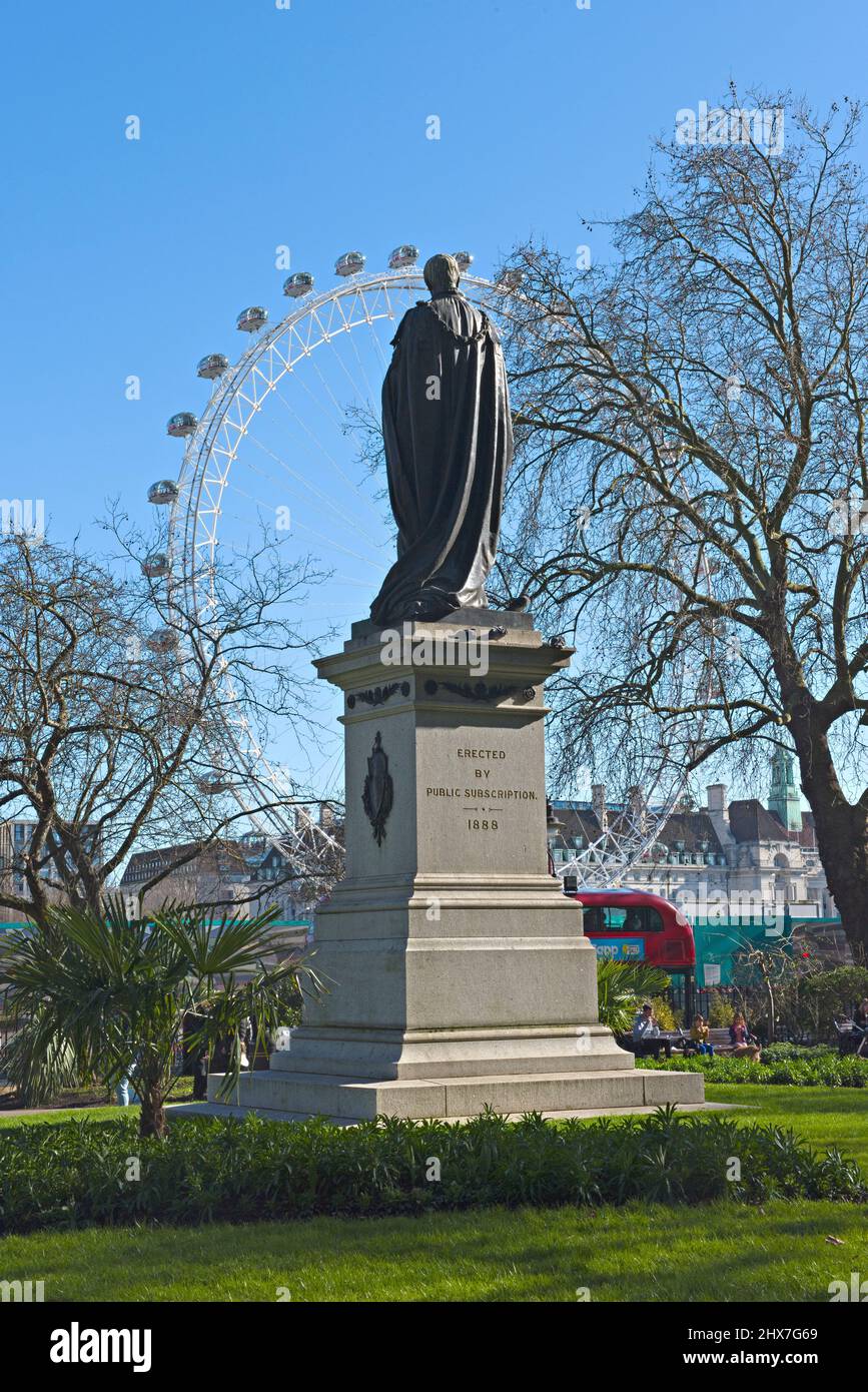 A statue of Henry Bartle Frere on the Thames embankment overlooking the river and the London Eye on the south bank. Stock Photo