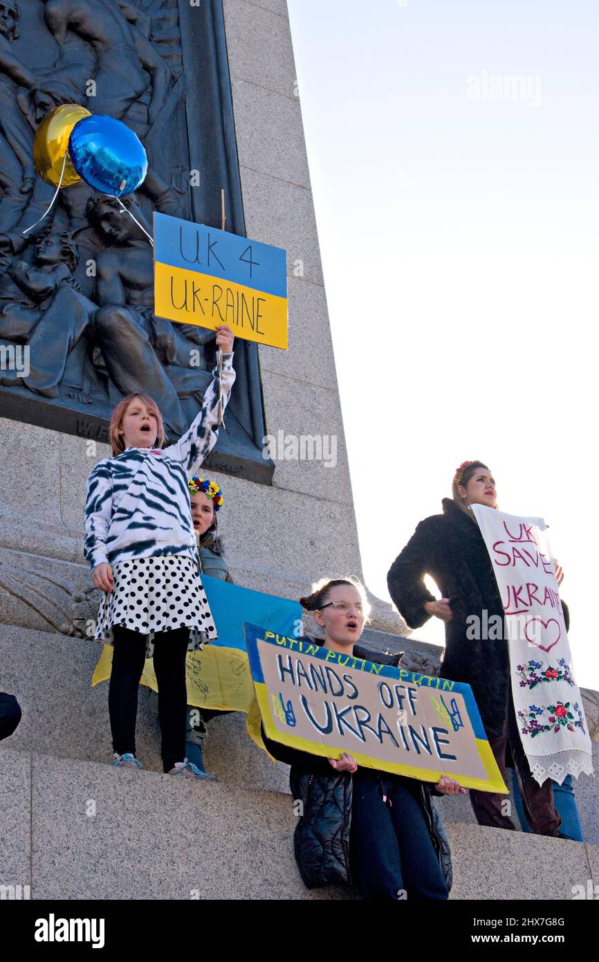 A group of young people hold up banners at a London protest against the Russian invasion of Ukraine 27 February 2022 Stock Photo