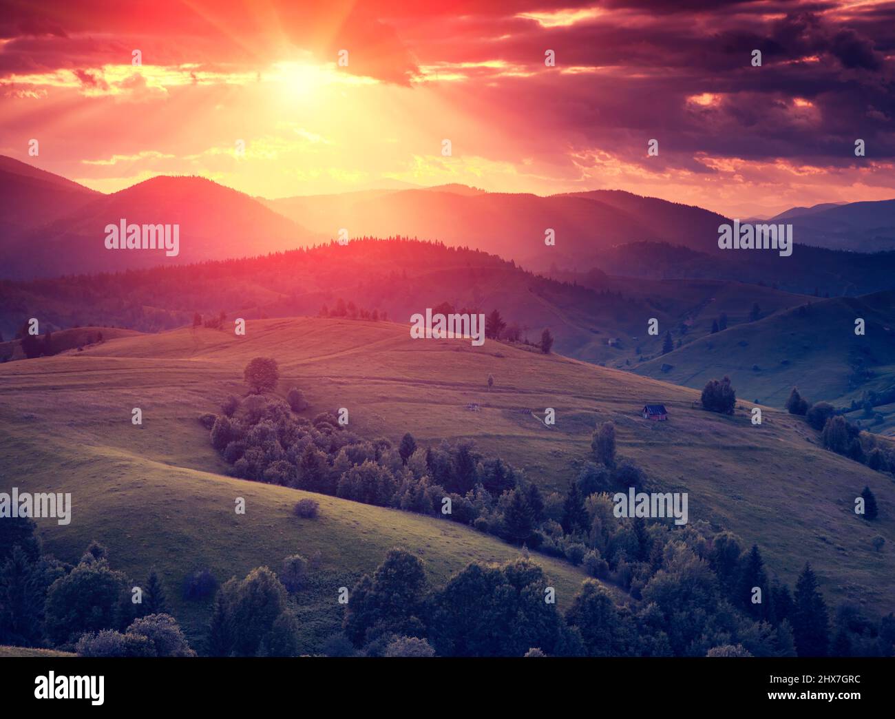 Fantastic sunny hills glowing by sunlight. Dramatic scenery. Carpathian, Ukraine, Europe. Beauty world. Retro style filter. Instagram colorful toning Stock Photo