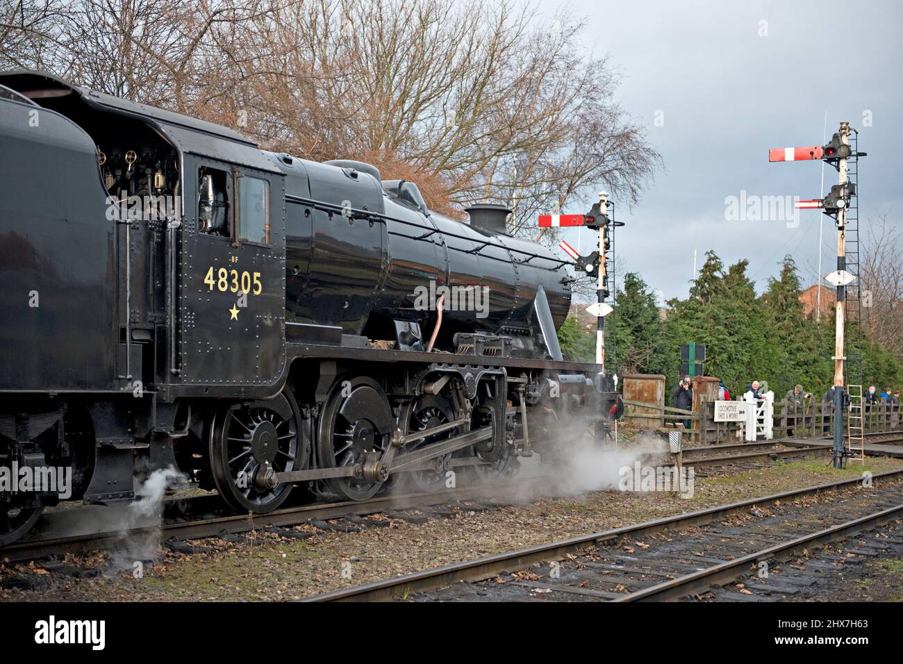 Preserved 8F No 48305 waits at the signals during the 2022 winter gala at the Great Central Railway heritage railway in Leicestershire Stock Photo