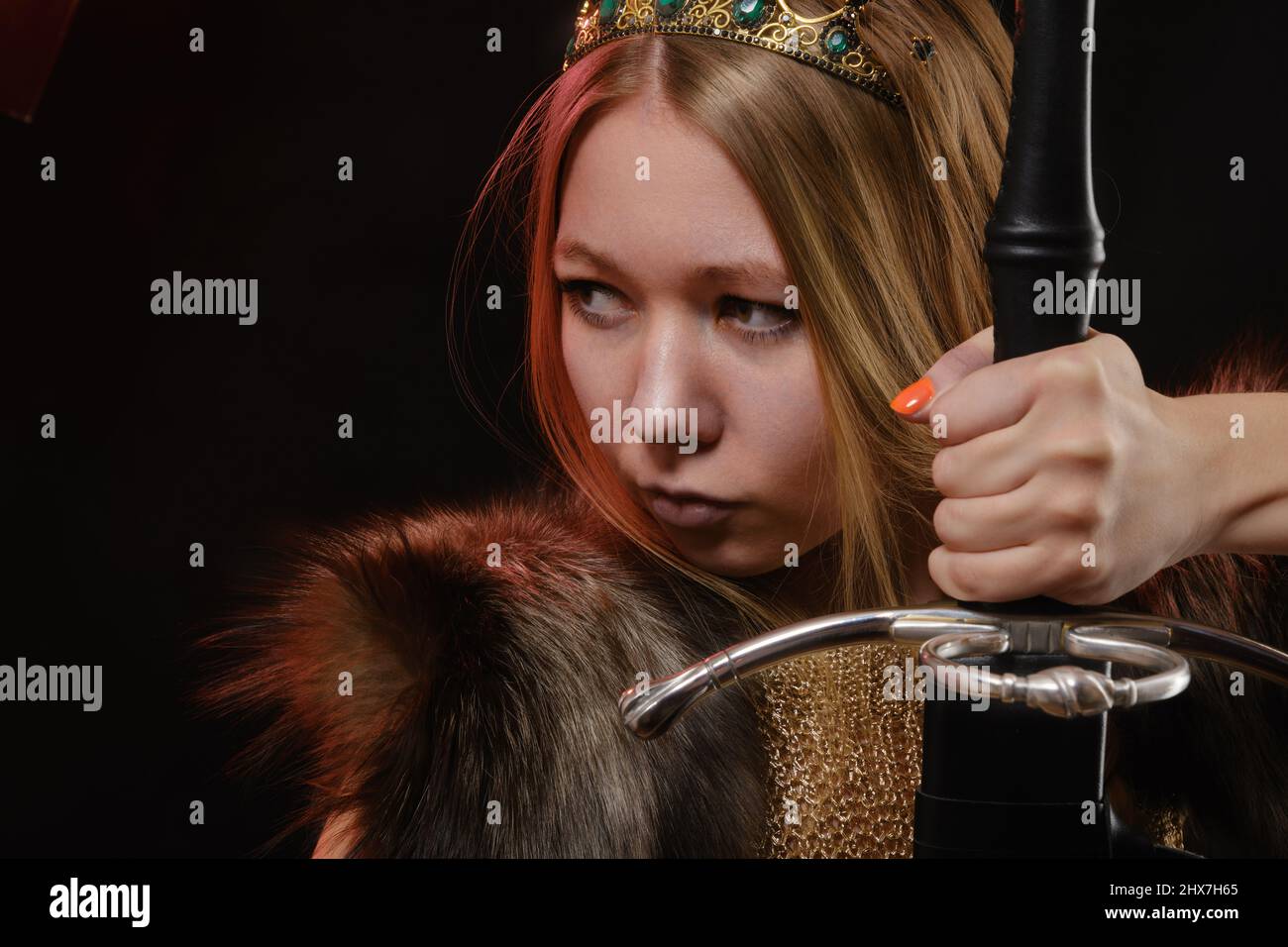 Portrait of viking woman in a traditional nordic clothes on black ...