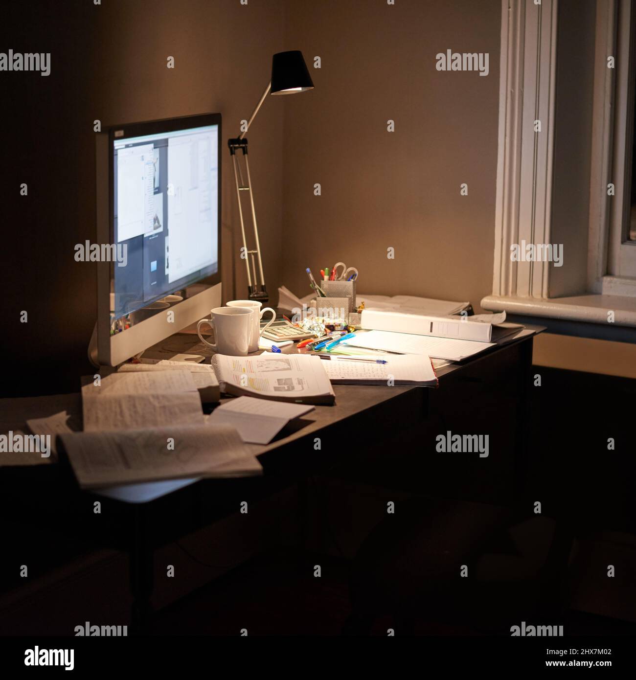 Ready for studies. Cropped shot of a pc and textbooks on a desk in a ...