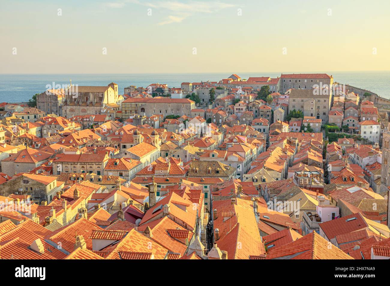 Aerial view on Dubrovnik walls at sunset in Croatia. View of Fort Lovrijenac fortress and church Crkva sv. Vlaho Saint Biagio of Dubrovnik UNESCO Stock Photo