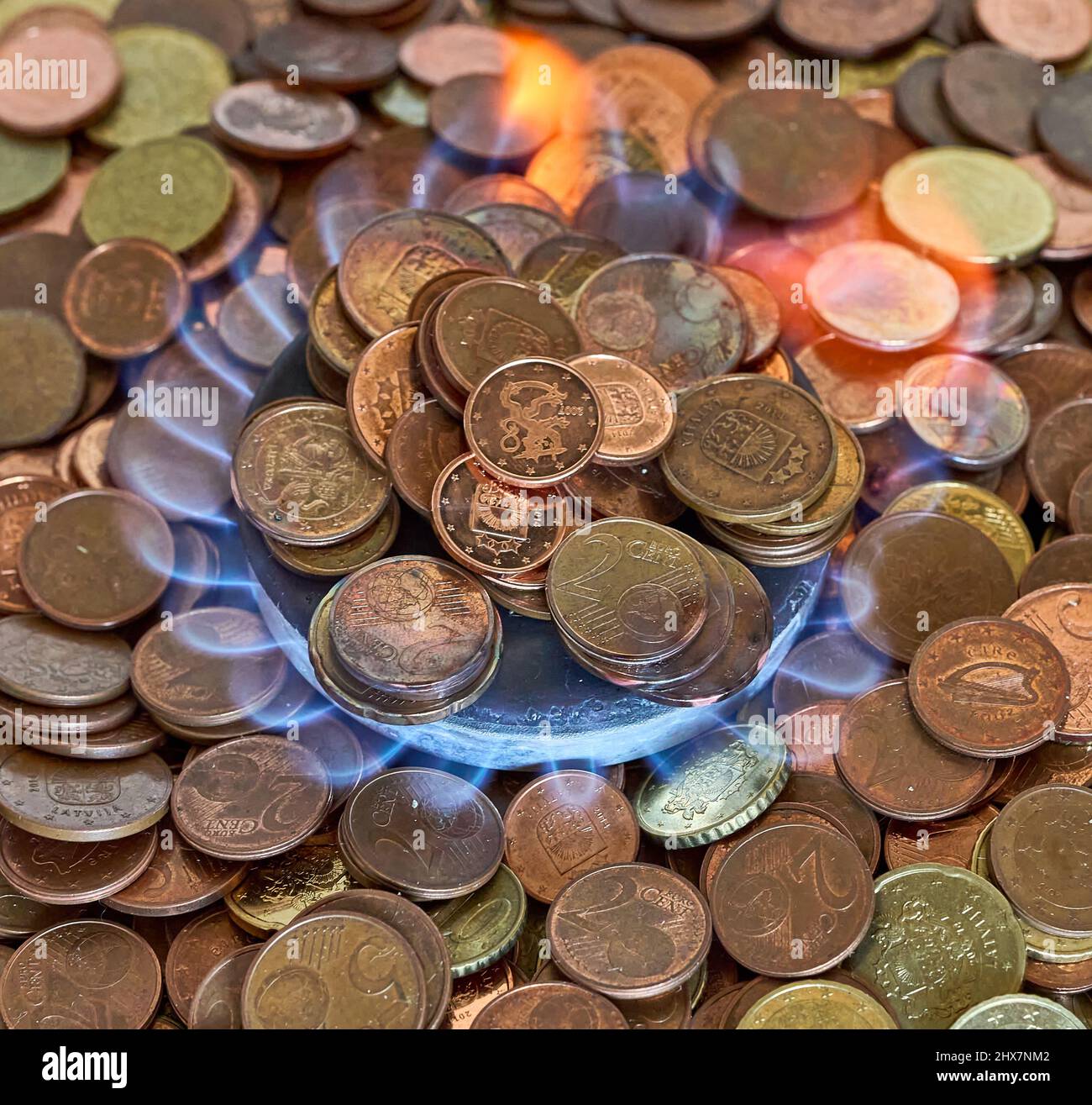 Euro metal coins burning in the gas stove Stock Photo Alamy