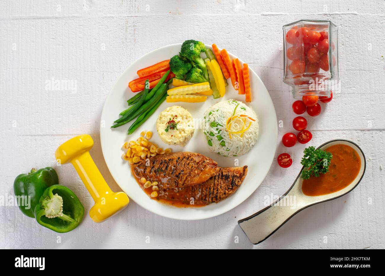 Grilled chicken/fish with rice & vegetables Stock Photo Alamy