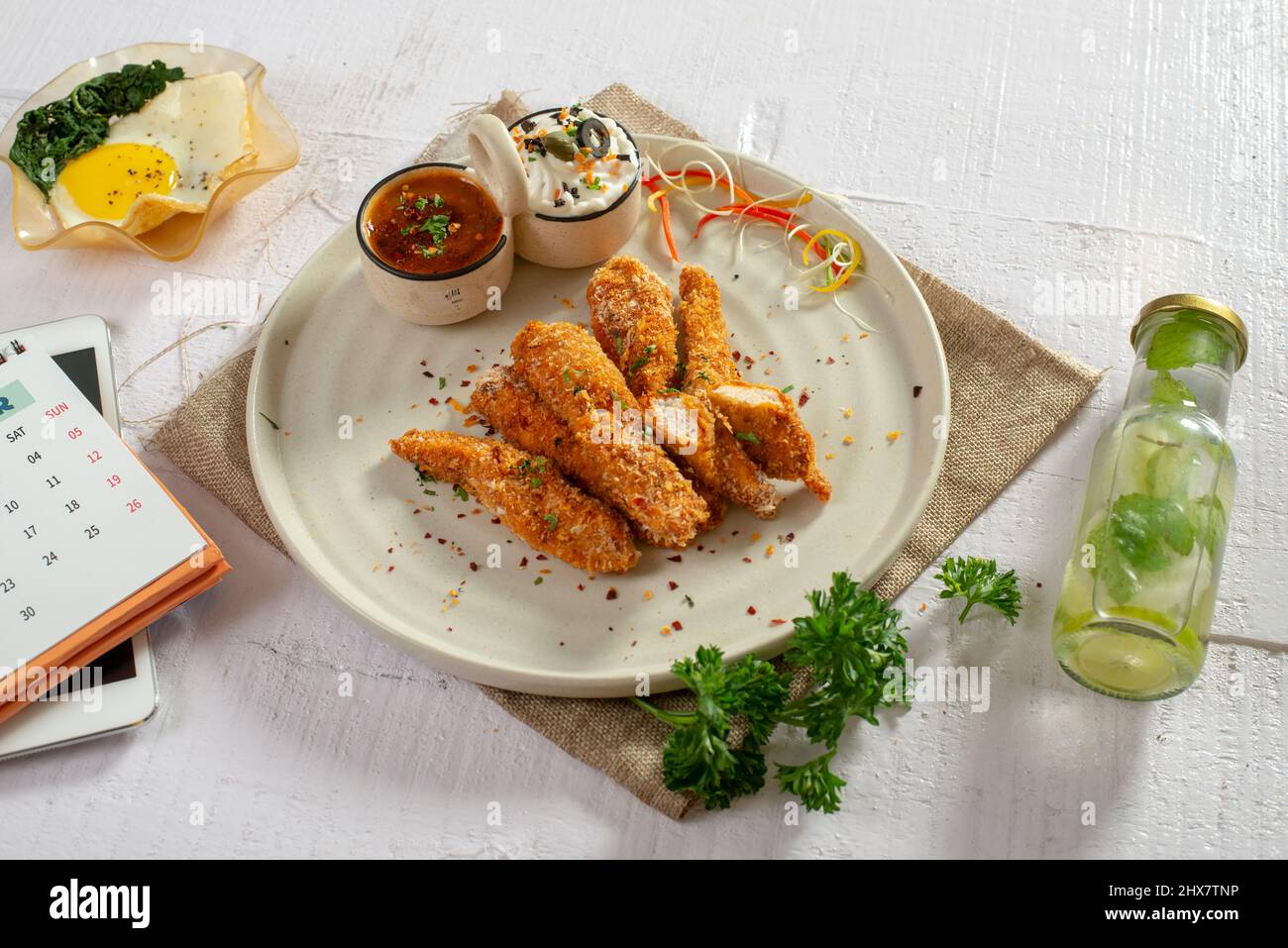 Fried chicken strips with dip Stock Photo - Alamy
