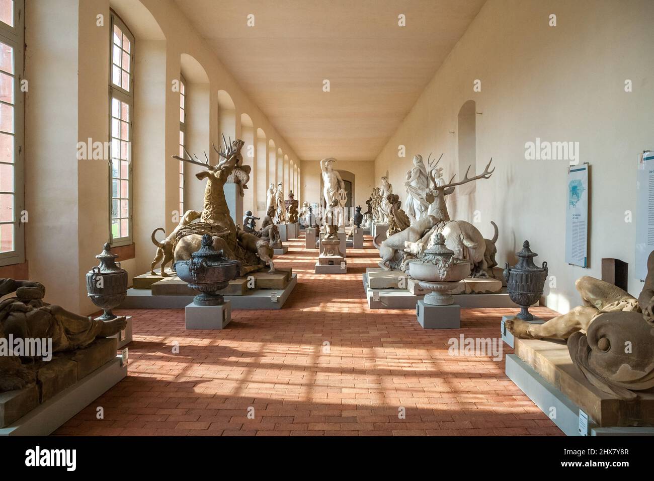 Great view inside the west wing of the orangery in the famous Schwetzingen Palace, Germany, where the original garden figures are set up to form a... Stock Photo