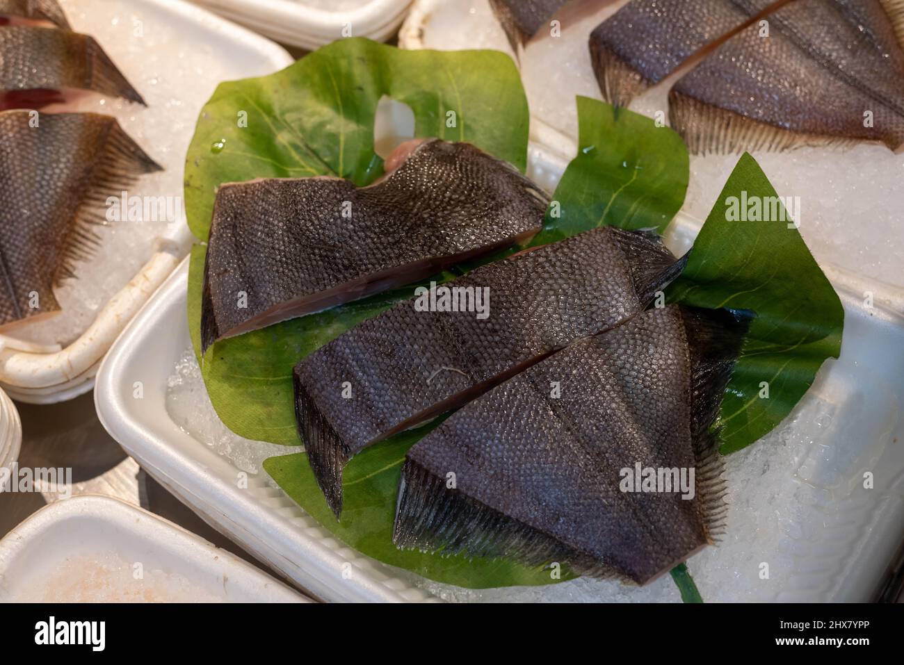 Fresh chopped flounder fish chilled and sold at an Asian wet market. Stock Photo