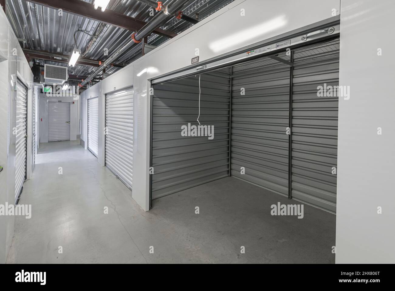 Open door to empty self storage unit interior, New Jersey USA Stock