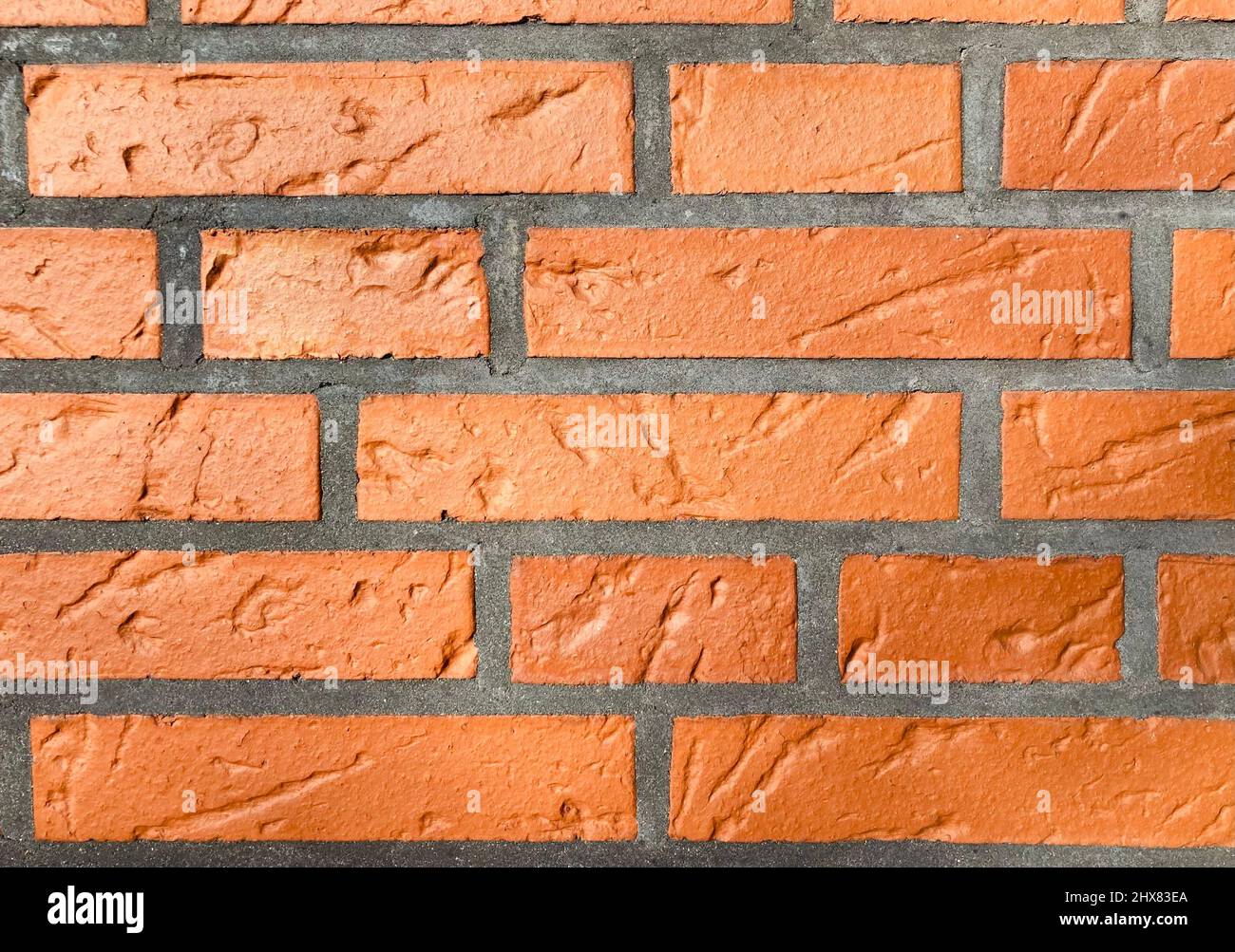 a reddish brown brick wall as background Stock Photo