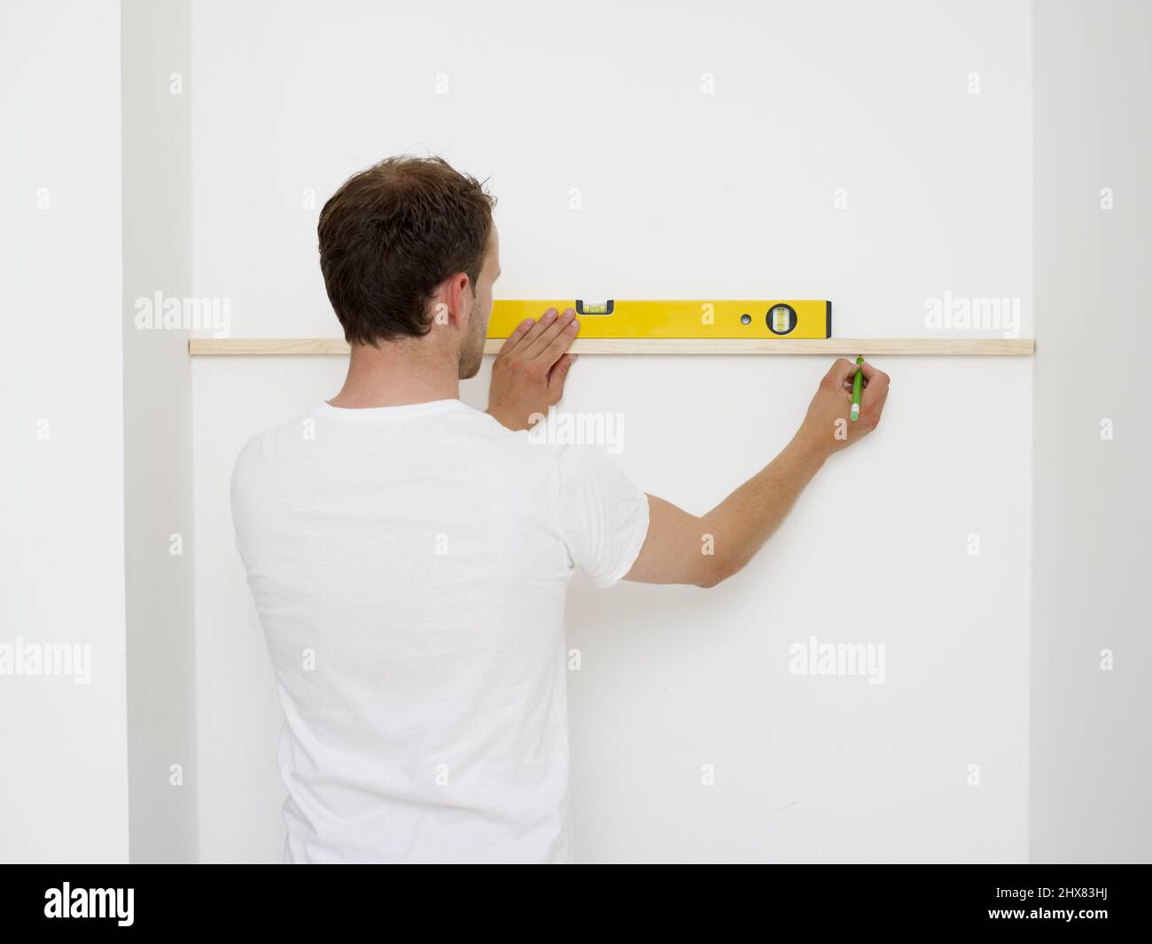 Building and fitting alcove shelves, fixing the battens to the wall