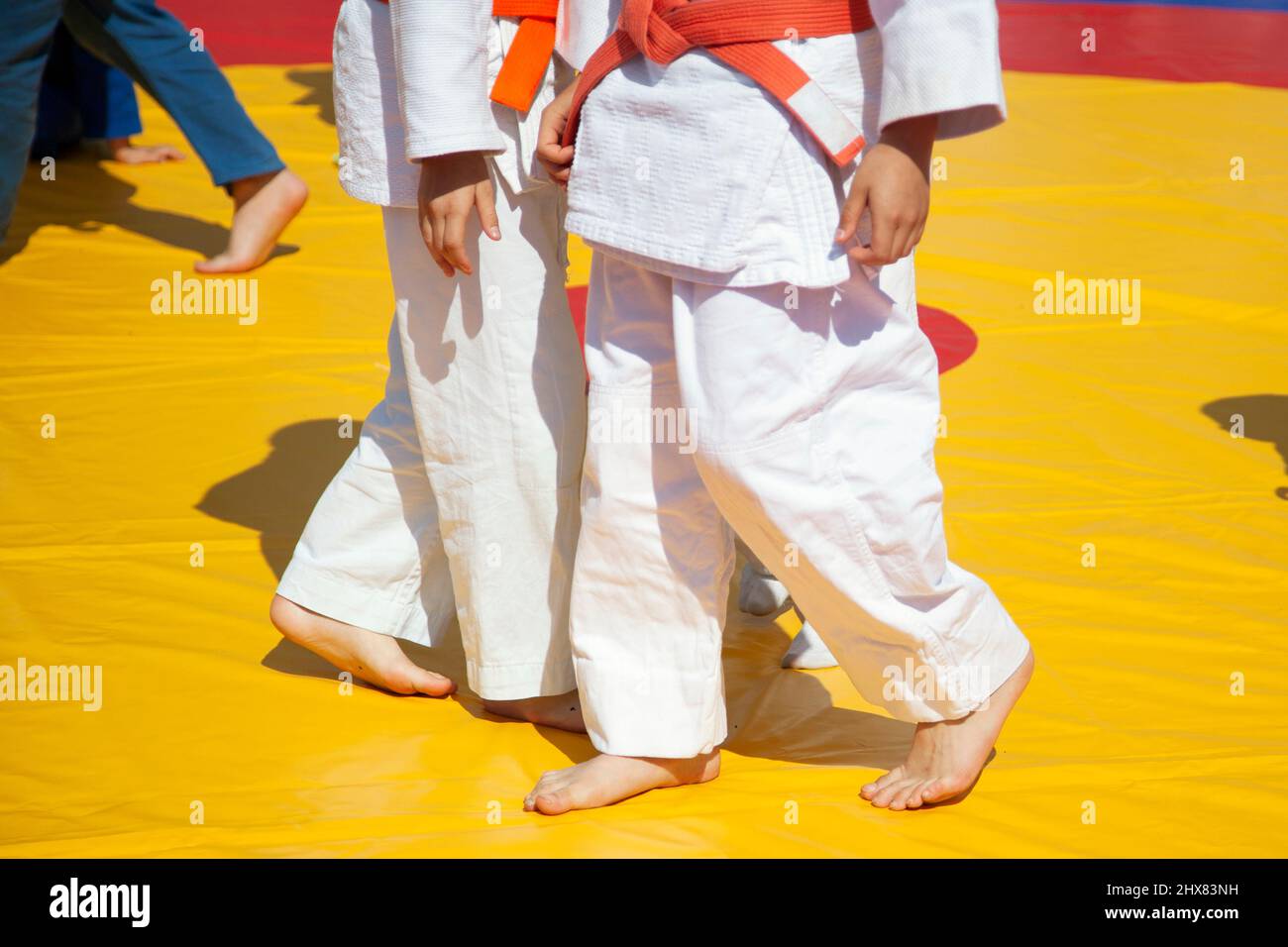Children's sports competition in judo. Kids in training. Sportswear for a child. Stock Photo